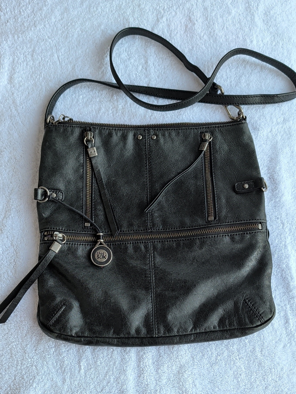 The Sak Sanibel black leather Foldover Crossbody Bag
